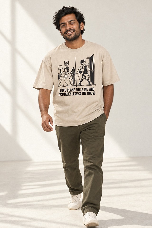 The shirt worn mid-stride across a bright studio floor