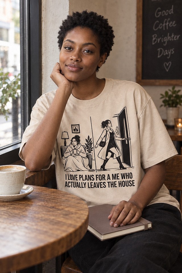The shirt worn at a cafe window with a coffee and a closed notebook