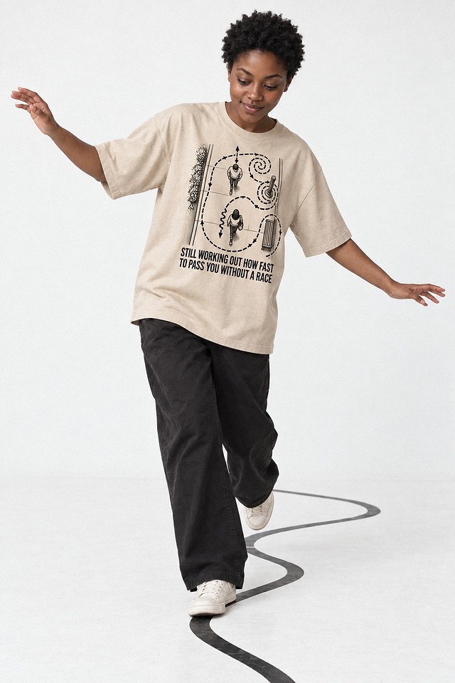 The shirt worn in a white studio, stepping along a curved line taped to the floor