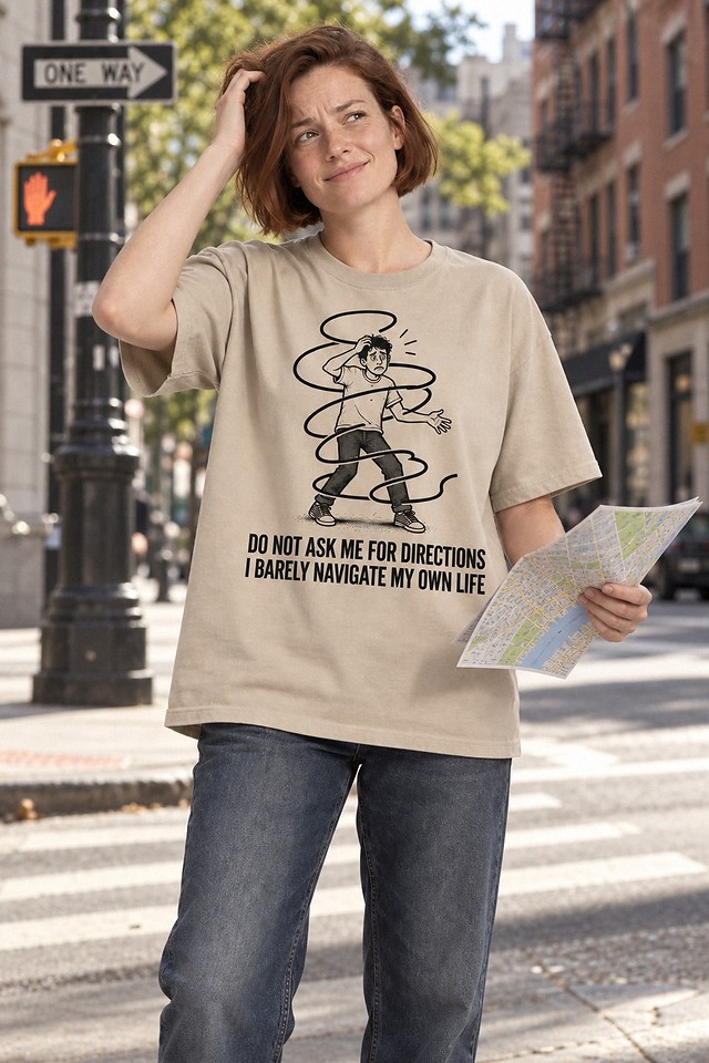 The shirt worn at a city intersection holding a folded paper map