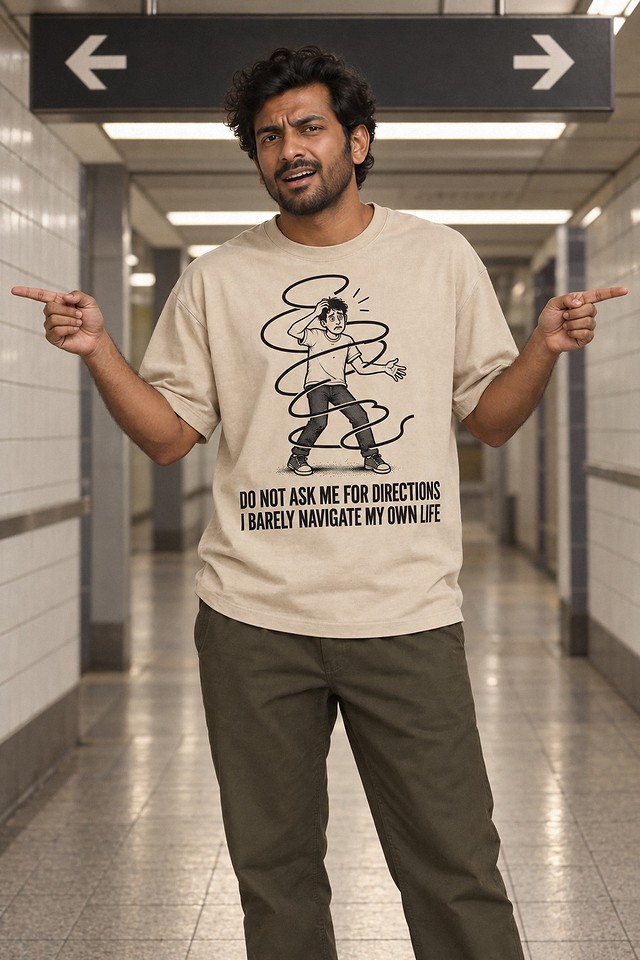 The shirt worn beneath two subway arrows, pointing in both directions at once